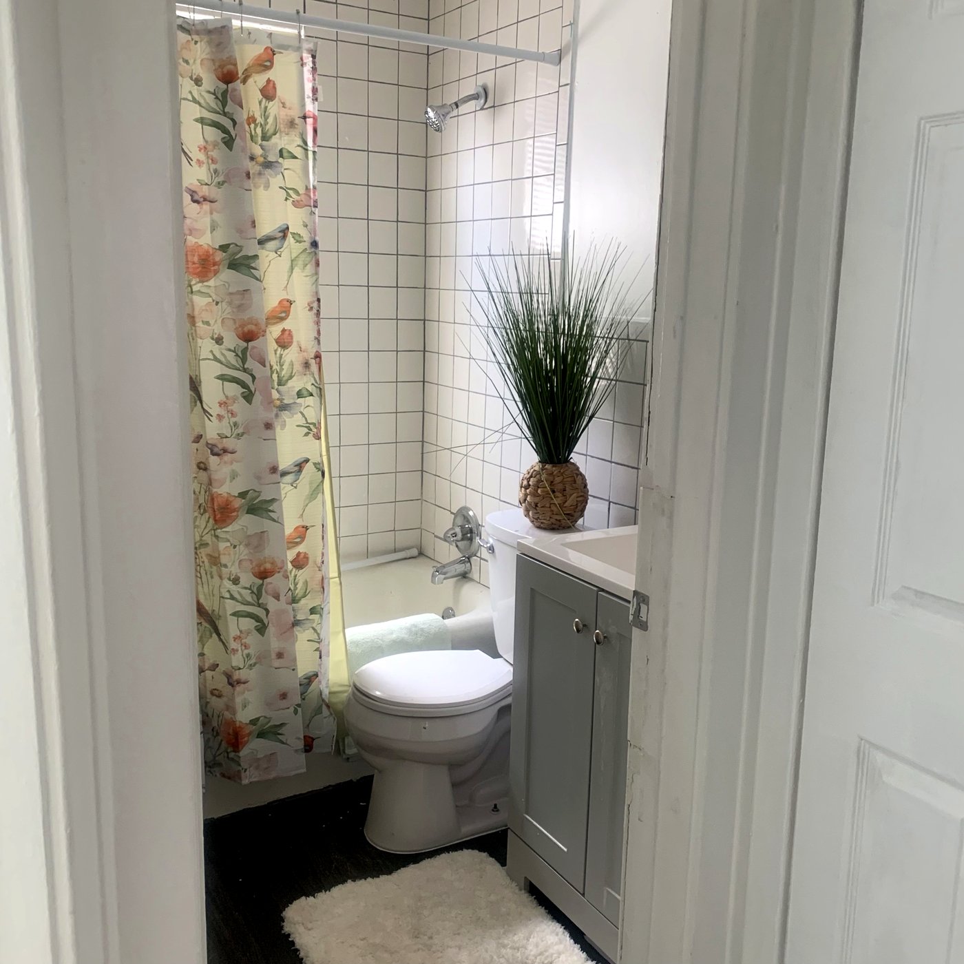 Bathroom with floral curtain